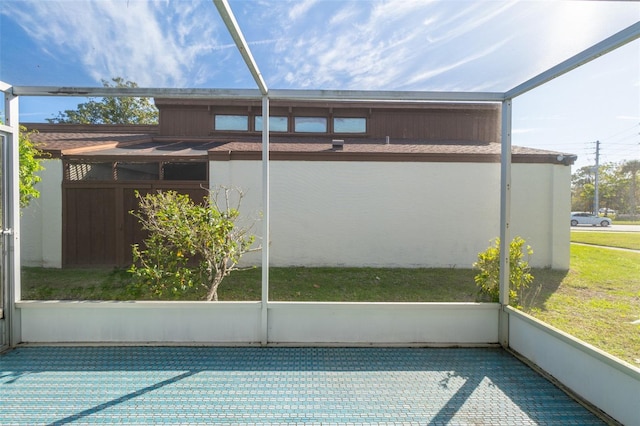 back of house with a lanai