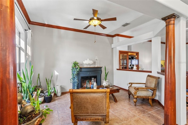 living area with ceiling fan, light tile patterned floors, ornate columns, and crown molding