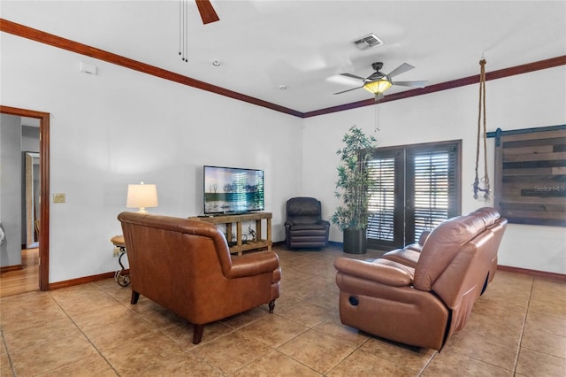 living room with ornamental molding, ceiling fan, and light tile patterned floors