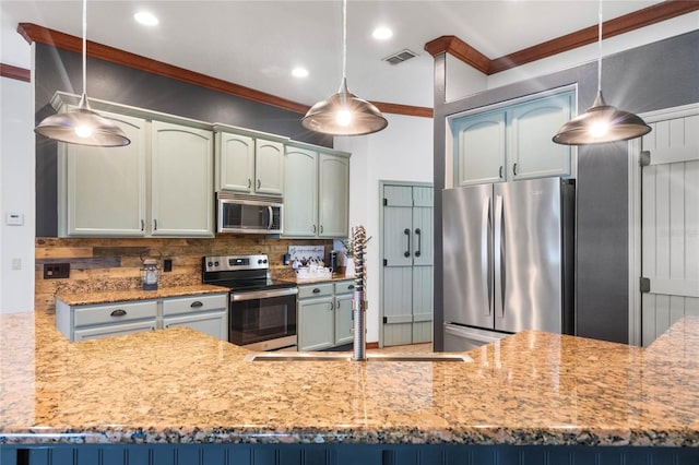 kitchen with stainless steel appliances, hanging light fixtures, backsplash, and ornamental molding