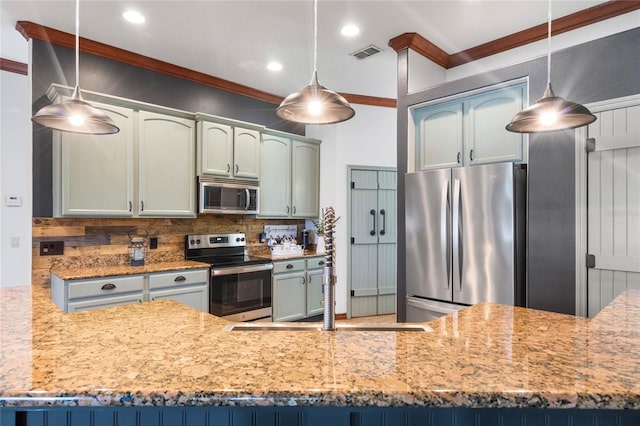 1562 Anorada Blvd, Kissimmee, FL 34744 - kitchen featuring appliances with stainless steel finishes, crown molding, backsplash, light stone countertops, and recessed lighting