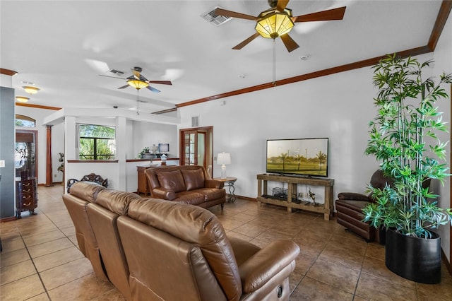 living room featuring ornamental molding, tile patterned flooring, and ceiling fan