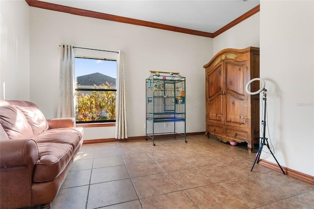 sitting room featuring light tile patterned floors and crown molding