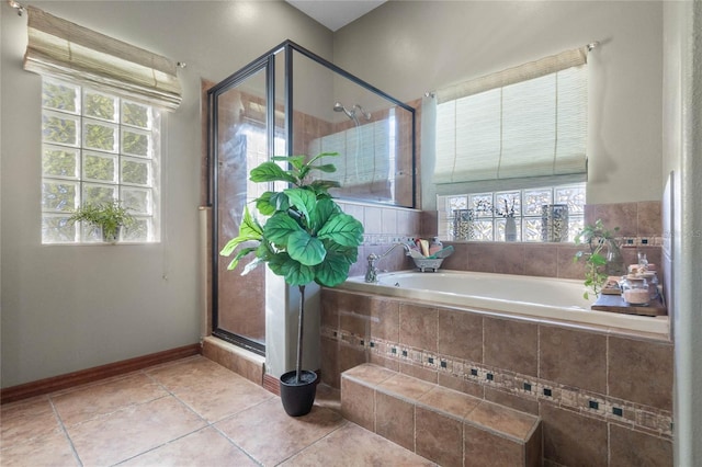 bathroom featuring tile patterned flooring and shower with separate bathtub