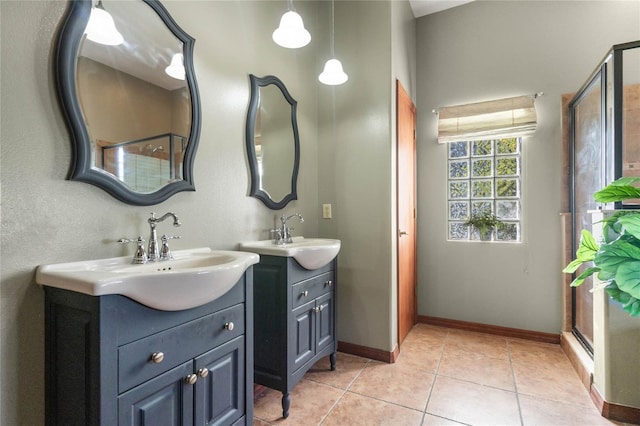 bathroom featuring vanity, tile patterned flooring, and an enclosed shower