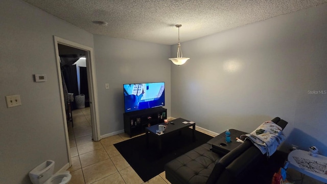 tiled living room featuring a textured ceiling