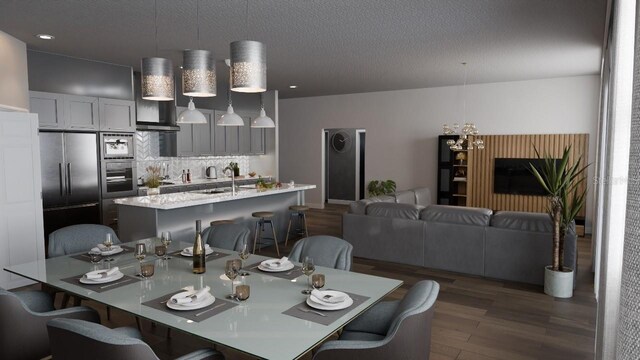 dining area with dark hardwood / wood-style floors and sink