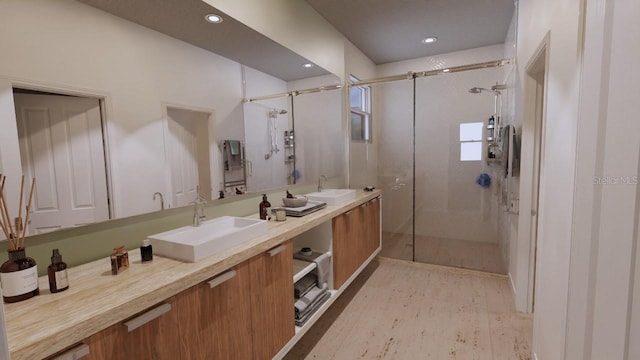 bathroom featuring vanity and a shower with shower door