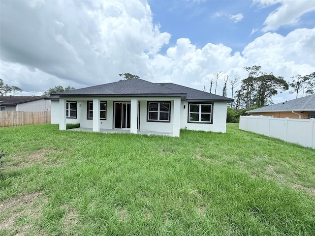 4683 Boston Ter, North Port, FL 34288 - rear view of house with stucco siding and a shingled roof