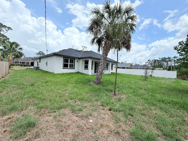 4683 Boston Ter, North Port, FL 34288 - back of property featuring stucco siding and central air condition unit
