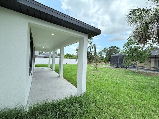 4683 Boston Ter, North Port, FL 34288 - view of yard with glass enclosure and a patio area