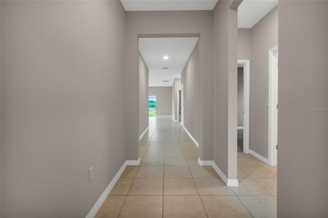 hallway with light tile patterned floors