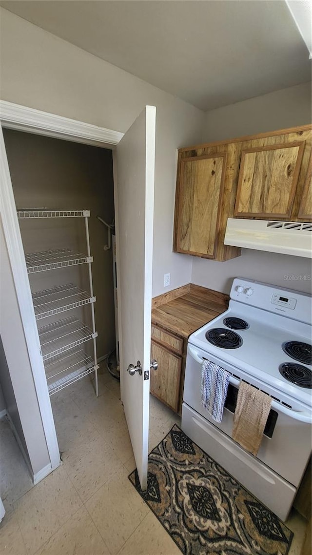 kitchen with white electric stove and extractor fan