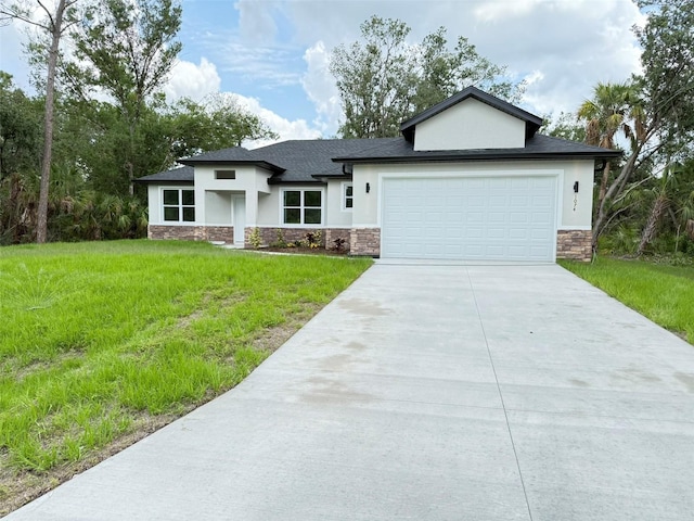 1074 Kacerik St, North Port, FL 34288 - view of front facade featuring stone siding, stucco siding, concrete driveway, a garage, and a front lawn