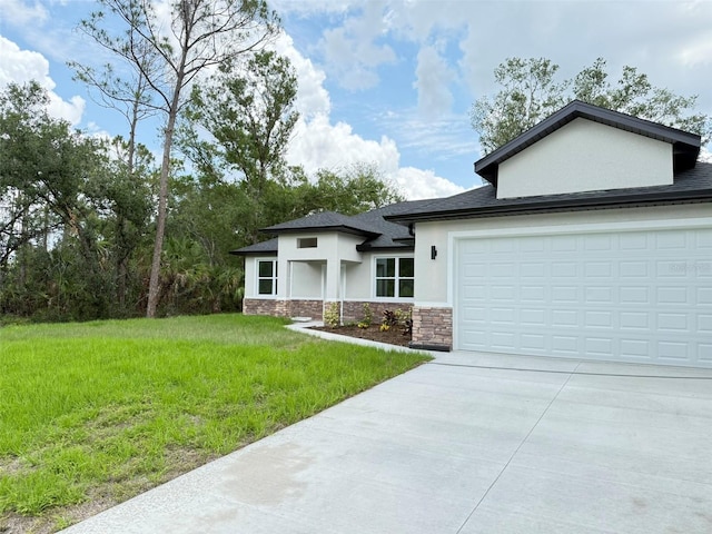 1074 Kacerik St, North Port, FL 34288 - view of front of house featuring stone siding, stucco siding, concrete driveway, a front lawn, and an attached garage