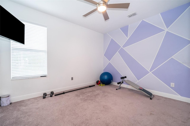 workout area with ceiling fan and carpet floors