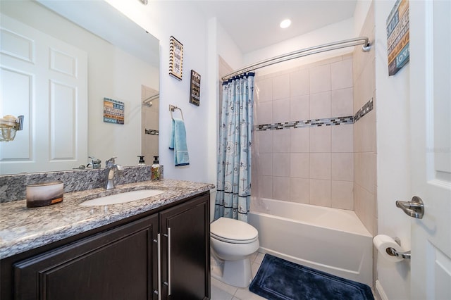 full bathroom featuring vanity, shower / tub combo with curtain, tile patterned flooring, and toilet