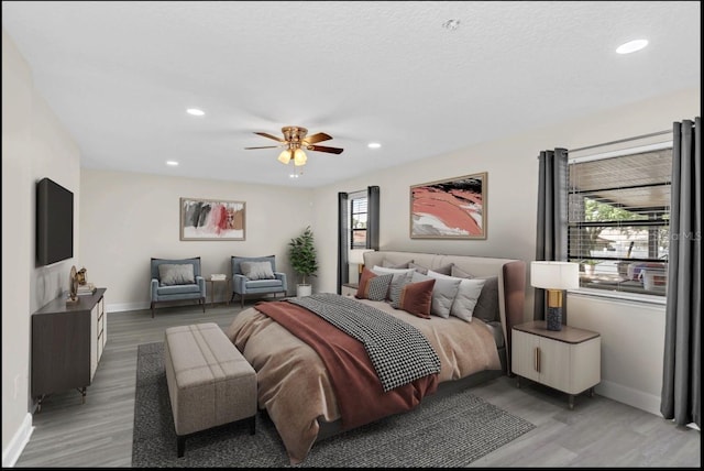 bedroom featuring ceiling fan and hardwood / wood-style floors