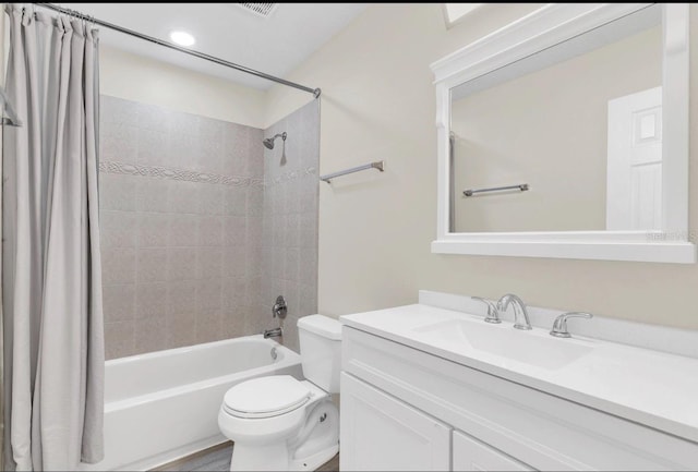 full bathroom with hardwood / wood-style floors, vanity, toilet, and shower / bathtub combination with curtain