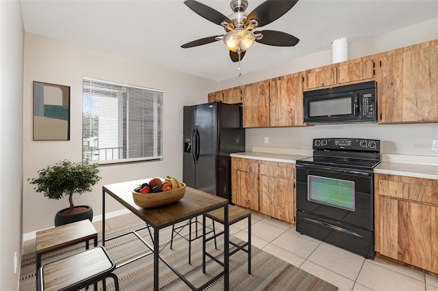 kitchen with ceiling fan, light tile patterned floors, and black appliances