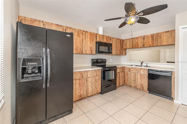 kitchen featuring light tile patterned floors, ceiling fan, sink, and black appliances