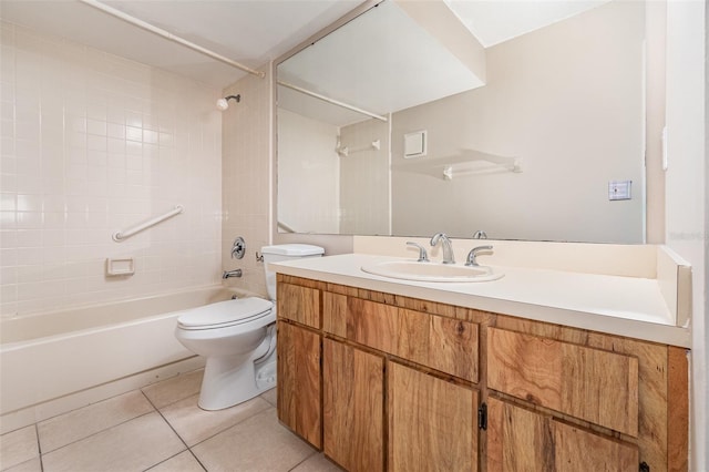 full bathroom with tiled shower / bath, vanity, toilet, and tile patterned flooring