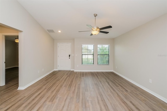 unfurnished room with ceiling fan and light hardwood / wood-style flooring