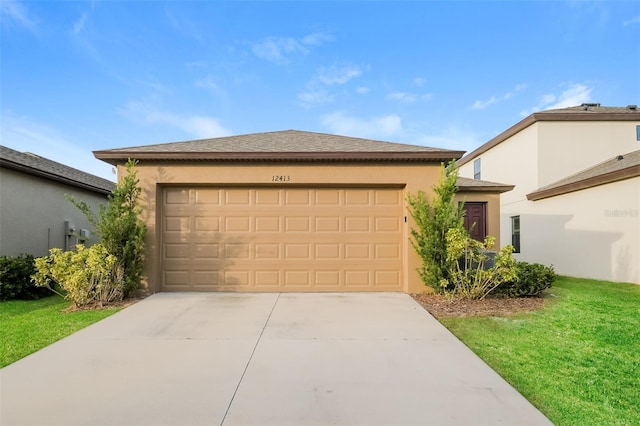 view of front facade with a garage and a front yard