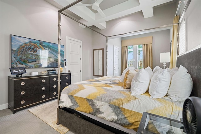 bedroom featuring light colored carpet, ceiling fan, beamed ceiling, and coffered ceiling