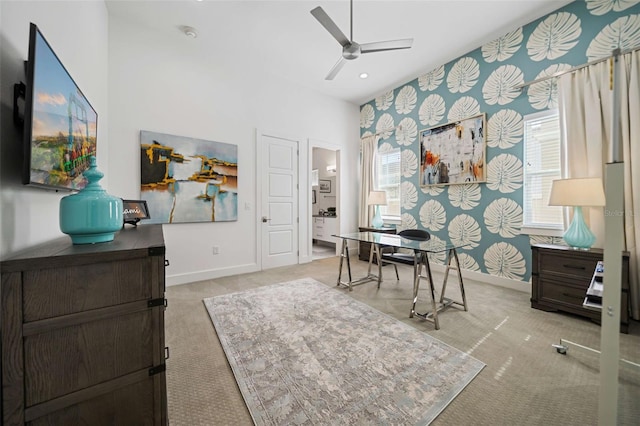 office featuring light carpet and ceiling fan