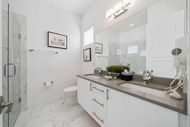 bathroom featuring toilet, an enclosed shower, and vanity