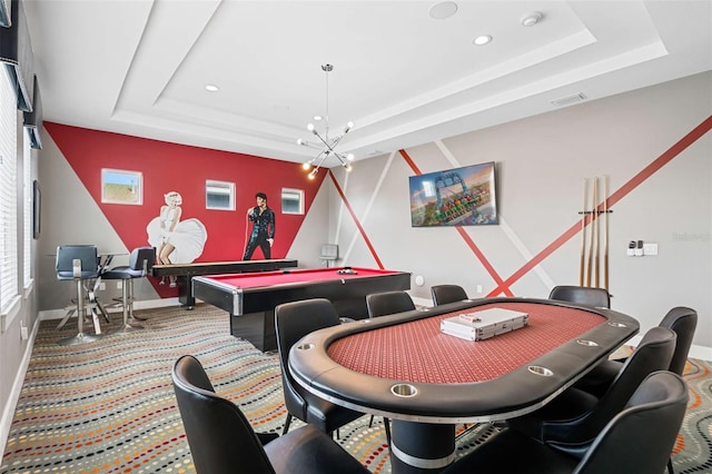 recreation room with a notable chandelier and a tray ceiling