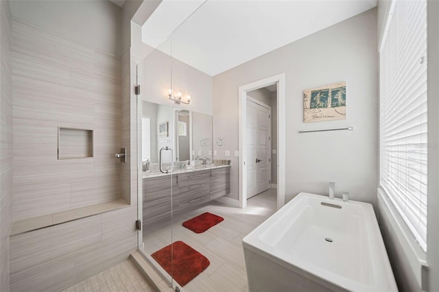 bathroom featuring tile walls, walk in shower, vanity, tile patterned flooring, and a chandelier