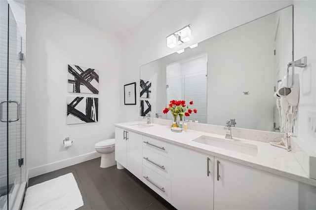 bathroom with walk in shower, vanity, and toilet