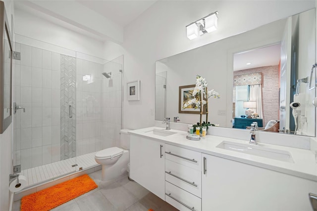 bathroom featuring a shower with door, vanity, toilet, and tile patterned floors