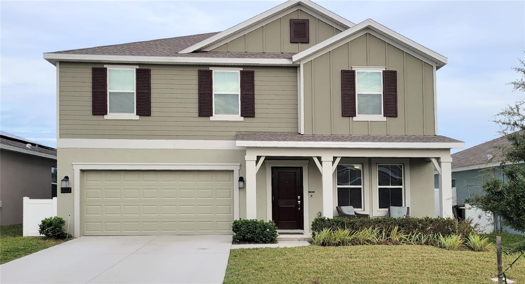 view of front of home with a garage and a front yard