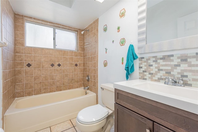 full bathroom with toilet, decorative backsplash, tile patterned flooring, tiled shower / bath combo, and vanity