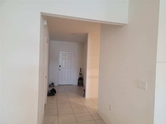 corridor with light tile patterned floors