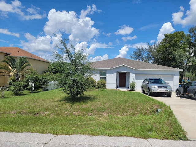 view of front facade featuring a garage and a front lawn