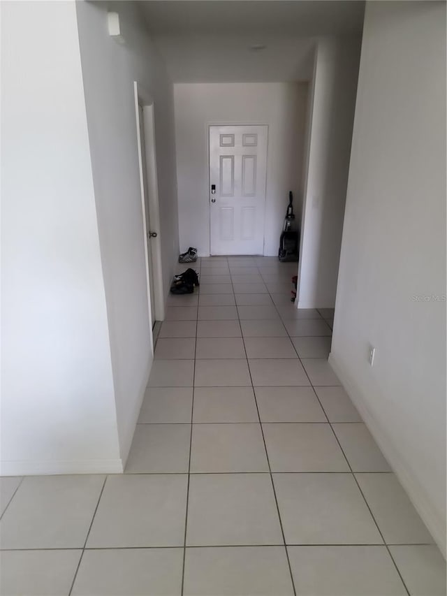 hallway featuring light tile patterned flooring