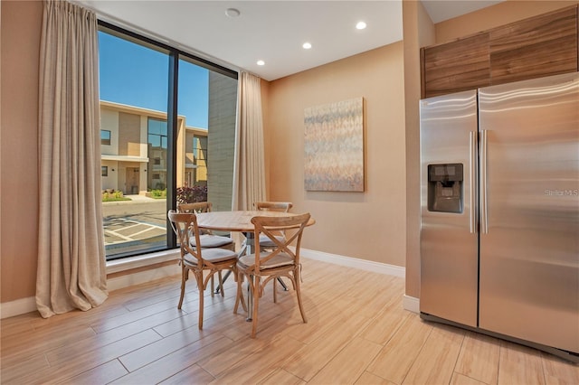 dining area with light hardwood / wood-style floors