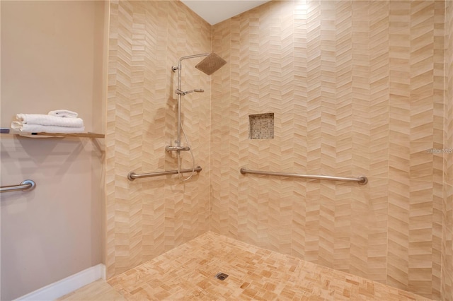 bathroom with tiled shower