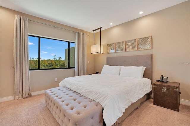 bedroom featuring light carpet