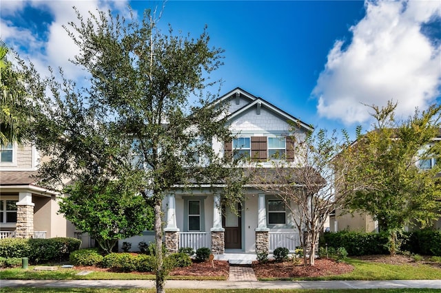 craftsman-style home with covered porch