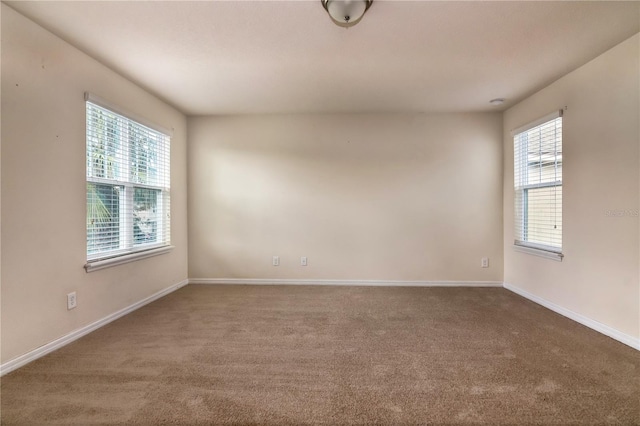 empty room with carpet flooring