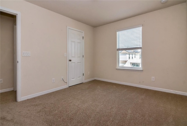 empty room with carpet flooring