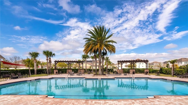 view of swimming pool with a pergola and a patio area