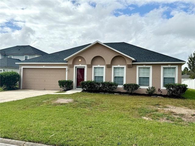 ranch-style home with a garage and a front yard