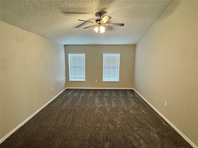 carpeted spare room with a textured ceiling and ceiling fan