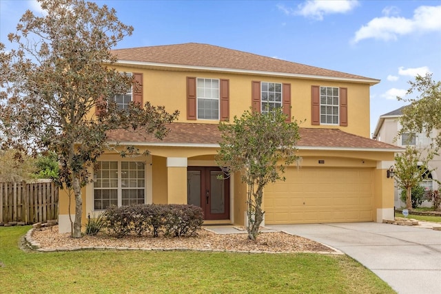 view of front facade with a front lawn and a garage